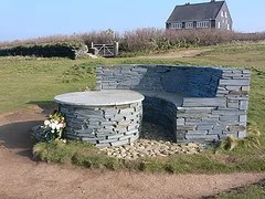 Stone bench in memory of Nick on the cliff at Treyarnon