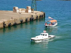 Boats passing the sea castle in Sidon