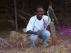 Boy with goat in Wiaga, Ghana