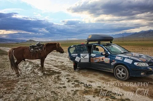 Horse meets car in Mongolia on the Mongol Rally Photo: Sherry Ott