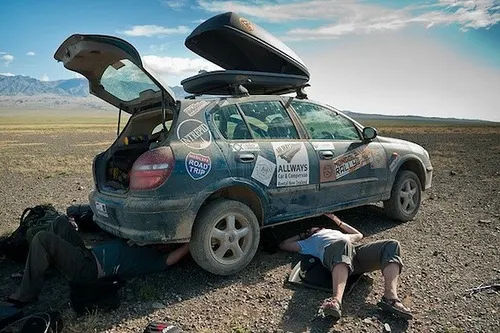 Muffler repair in Mongolia on the Mongol Rally Photo: Sherry Ott