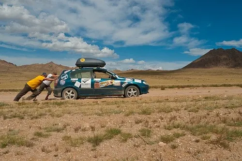 Pushing a car in Mongolia on the Mongol Rally Photo: Sherry Ott