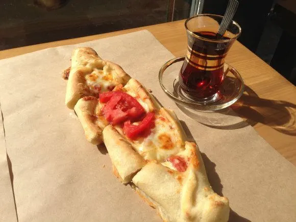 Peinirli or open topped pie served at Feyrouz in Athens with Turkish tea Photo: Heatheronhertravels.com