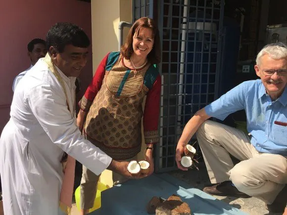 Breaking coconuts to open the water purification unit in Ananthapur, India Photo: Heatheronhertravels.com